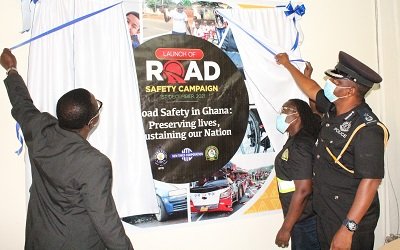 • Mr. Martin Adu Owusu, DCOP Martin Ayiih & Ing. Mrs May Obiri-Yeboah unveiling the campaign poster