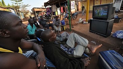 Some youth watching TV Pix