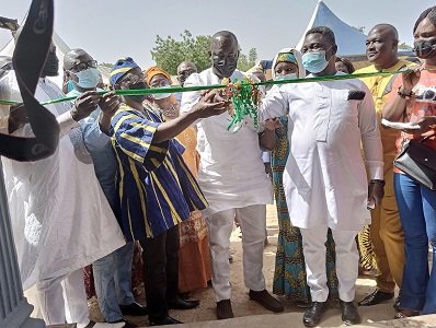 • Dr Salih cutting ribbon to commission the office