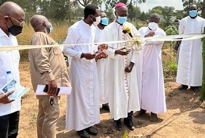 • Most Rev. John Bonaventure Kwofie cutting ribbon to signify commencement of the project