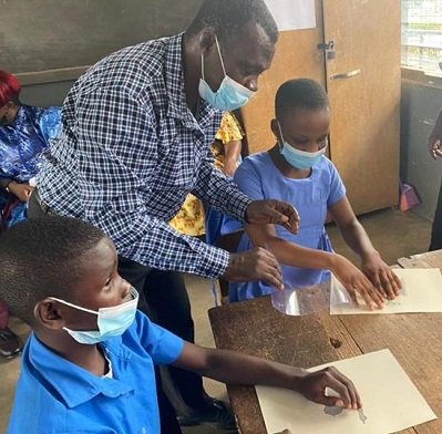 • Mr. John Lartey, a teacher, demonstrating the use of the Braille materials at the Akropong School for the Blind