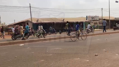 The youth disperse after the security personnel fired several shots in Lamashegu of the Tamale Metropolis on Sunday, February 13, 2022.