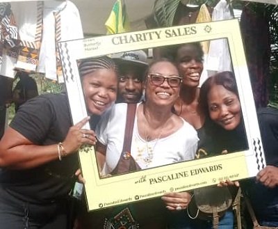 Pascaline Edwards (middle) in a photograph with some patrons