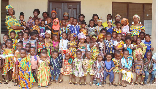 The pupils and leadership of the school in a group photograph