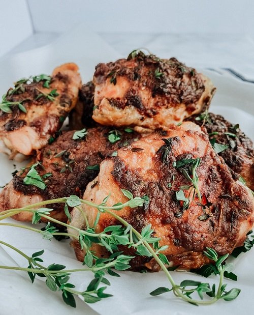 • Clove and garlic baked chicken garnished with thyme