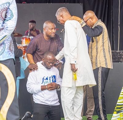 • Men of God praying for Albert Acheamopong at the launch