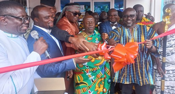 • Mr.Kwesi Agyemang (first right) with Ogyeahohoo Yaw Gyebi and Carlos Ahenkorah cut the ribbon. Inset: The Banahene Specialist Hospital