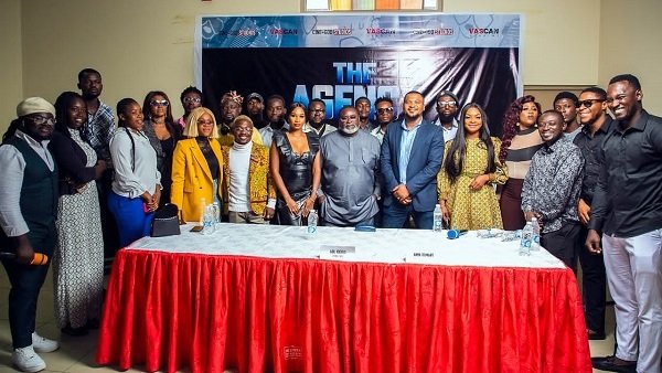 A group photograph of cast and crew in the movie