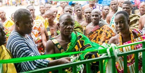 • The Community Center. Inset: Nana Agyeman IX, Nana Essoun II and Nana Pra II, Queen Mother of Nyanso jointly cutting the tape to commission the center