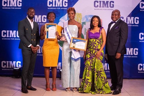 Cynthia Ofori-Dwumfuo, (middle) displaying her awards and flanked by some staff of Hollard Ghana
