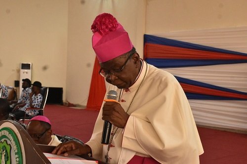 • Inset: Most Rev. Philip Naameh delivering his speech while the Marshallans listen attentively