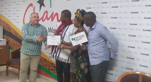 Mr.Naaman receiving his certificate from the Goge Africa team