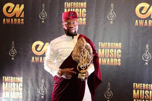 • Prophet Atarah poses with his plaque