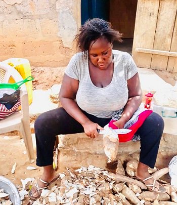 • Sharon busily processing some cassava