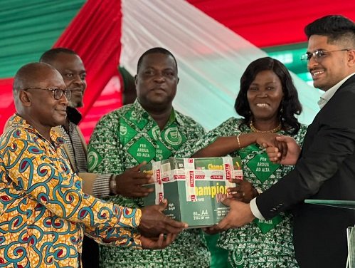 • Mr. Sharda (right) making a presentation to Mrs. Tetteh while others look on