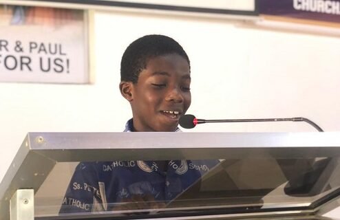 A pupil reading the eighth lesson in French