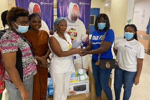 • A staff of Mybitstore presenting the items to nurses at the hospital