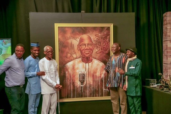 making a presentation to Mr. Joe Lartey (First left)