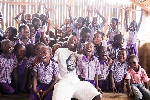 • Atsu (centre) was a regular visitor to the charity’s home at Senya Beraku in Ghana