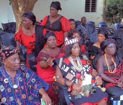 Mama Nyamlor III (middle) sits in state during the ceremony