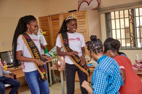 • Miss Ghana queens dancing with the children