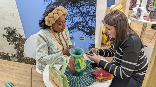 • Ms Okbell Majdoub (left) speaking to a client at the fair