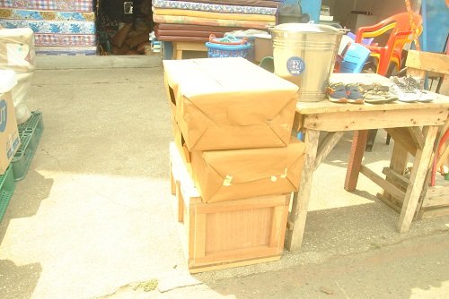 Wooden and metal boxes waiting for their owners
