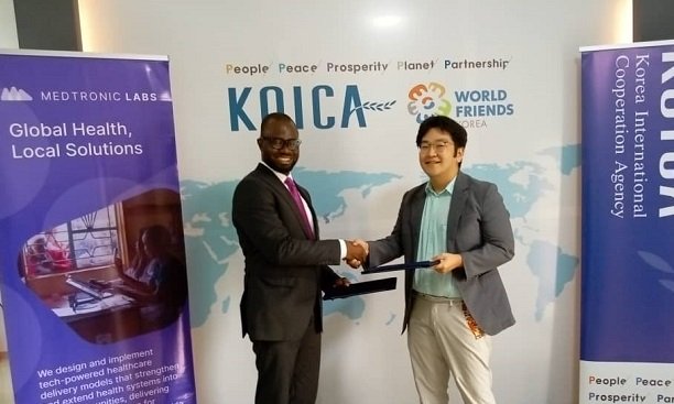 Mr Kwabena Asante Offei (left), with Mr Seungmin Oh (Right) exchanging the agreement after the signing.