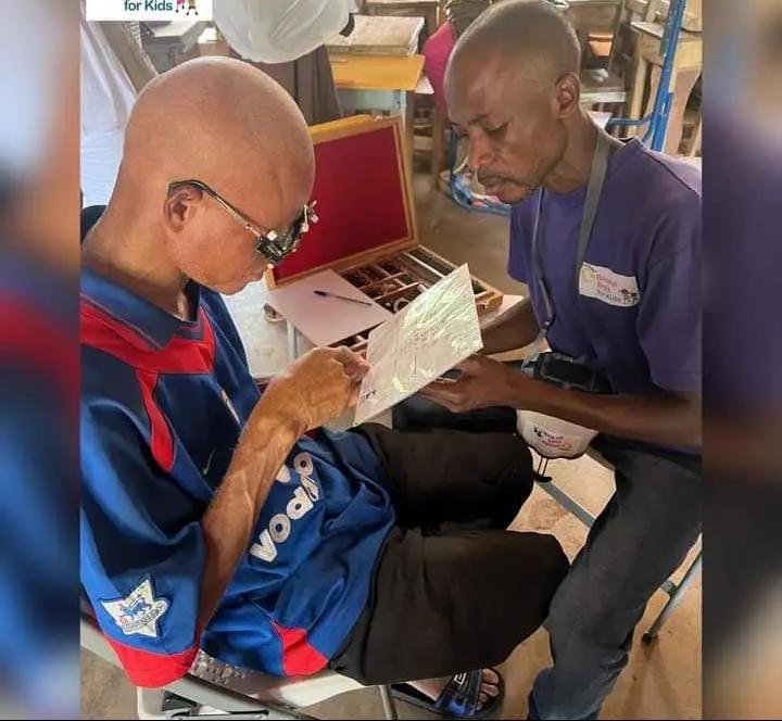 Mr Balure screening a resident
