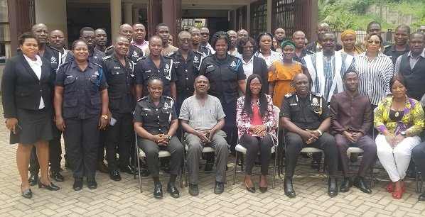 Mr Sarpong with officers at workshop