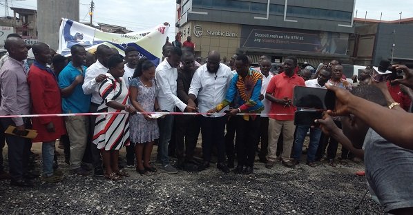 Some members of the association cutting ribbon at the ceremony