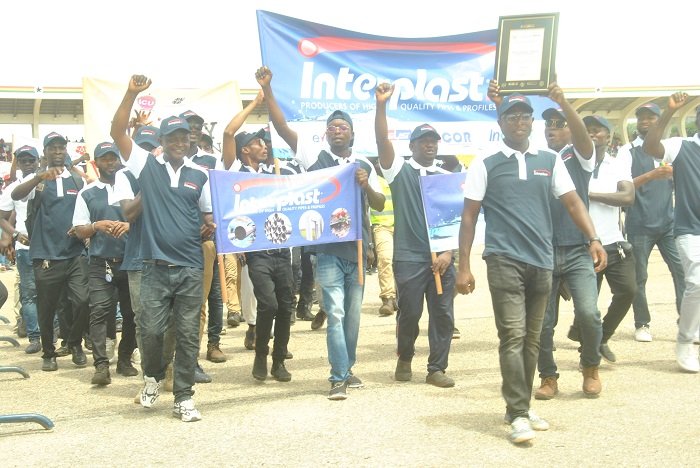 Some of the workers marching pass the dais