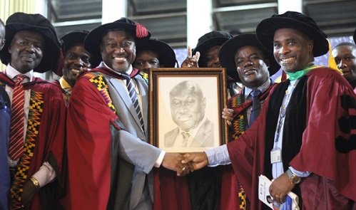 Prof Gordon Awandare (2nd left) being congratulated by some of his colleagues