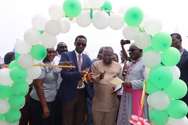• Inset: Mr. Jesse Prah (second left) assisting Mr. Darko-Mensah (3rd left) to inaugurate the rice factory