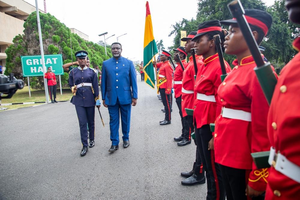 Mr Andy Okrah inspecting a guard of honour .