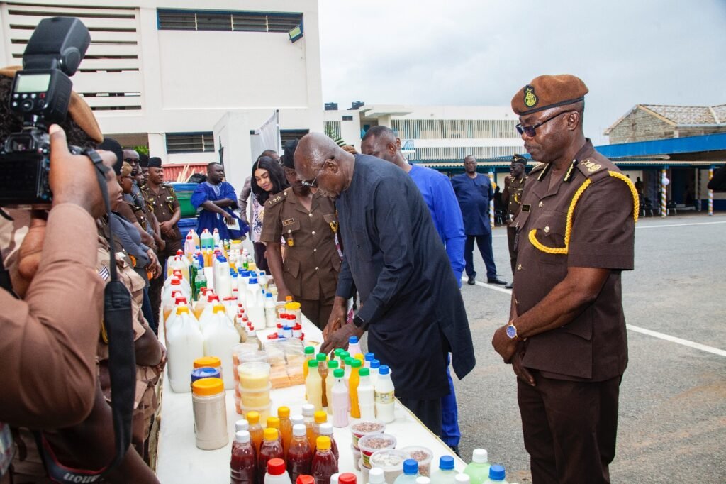 Mr. Ambrose Dery (second from right), flanked by Mr. I.K Egyir (right) and other officers, inspecting products made by the inmates