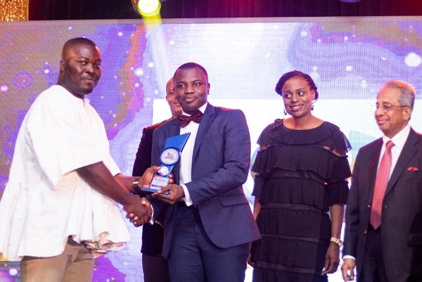 Mr. Emmanuel Excellove Egyabeng receiving an award.