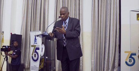 Professor Peter Lamptey (inset) making his presentation while the audience listen attentively