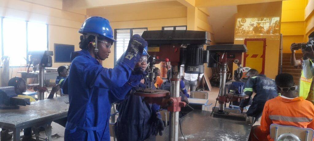 Janet Serwaa Setugah and her colleague operating a wielding machine at the AVTI