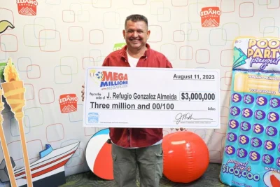 • Almeida displaying the dummy cheque