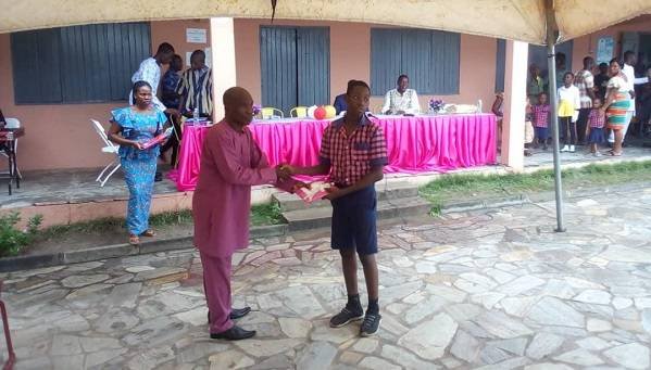 A student being honoured for his good work