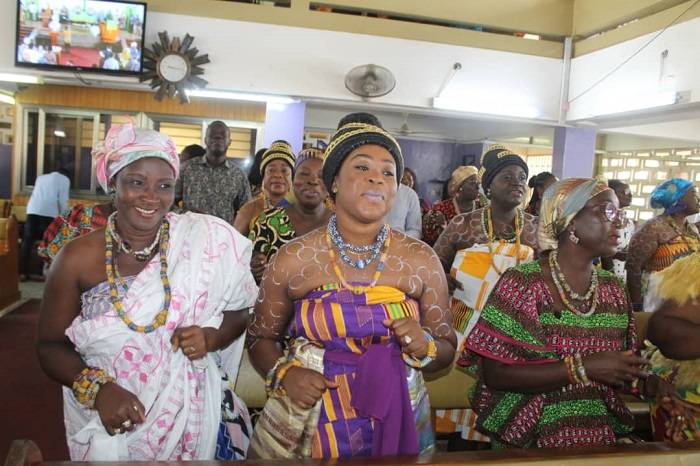 Members of the congregation in traditional wear