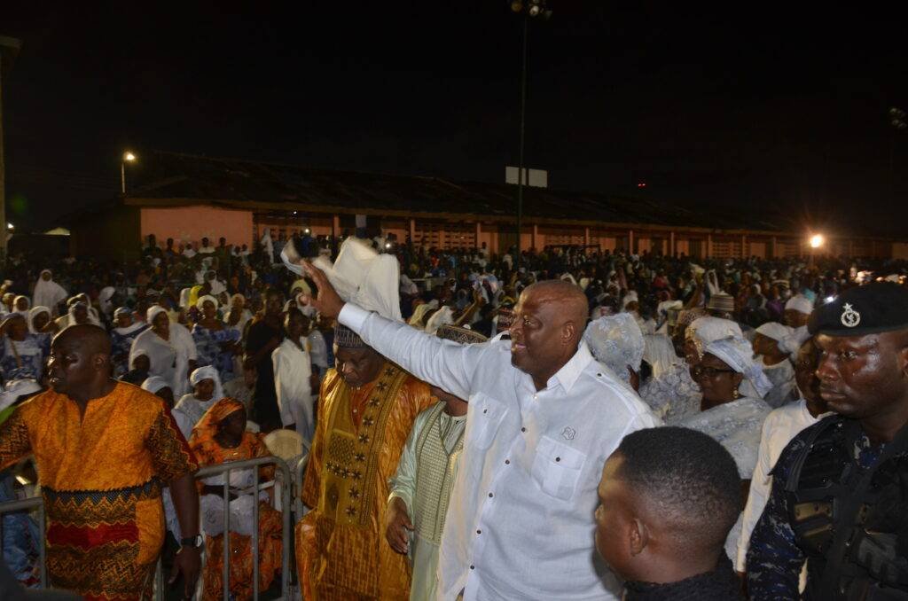 Mr Henry Quartey(hand raised)responding to cheers from the gathering 