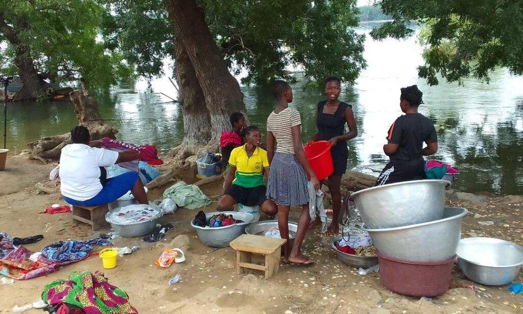 Some affected victims of the Akosombo Dam spillage washing their cloths by the river