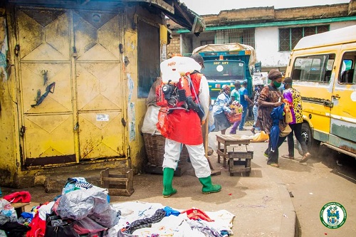 • A staff of AMA spraying the market