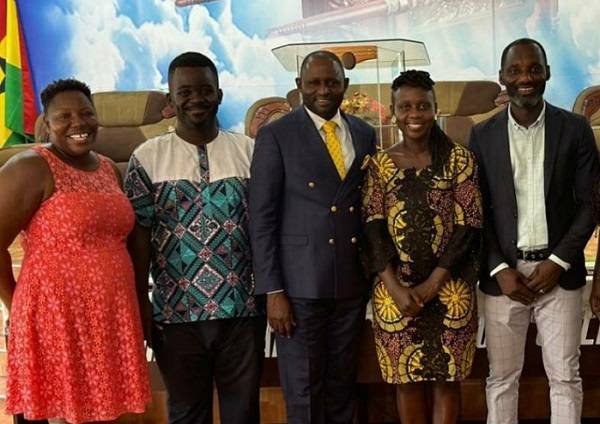 Rev Awintia (in the middle) with some journalists.