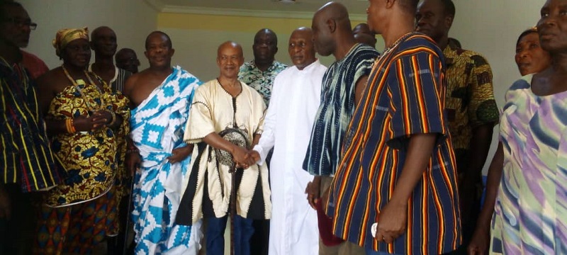 Togbega Dzekley VII presenting the items to one of the community leaders