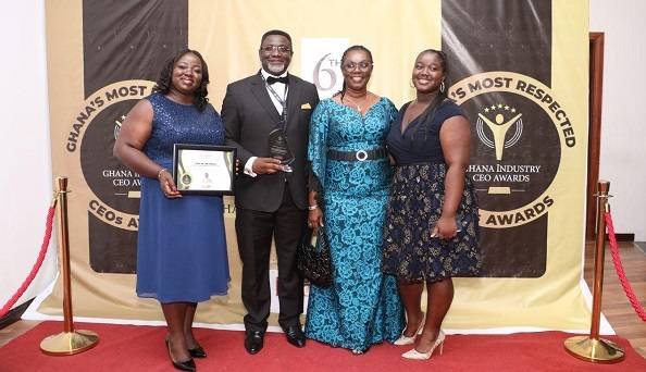 Dr Andy Osei Okrah with Mrs Ursula Owusu-Ekuful, (second from right), His wife, Alice and daughter Hilary (right) after the award.
