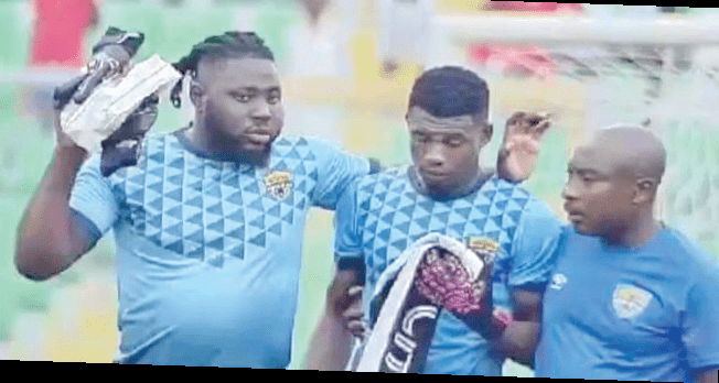 • Richard Atta (left) and Kwame Opare Addo (right), Comunications Director, console Ayi after the game