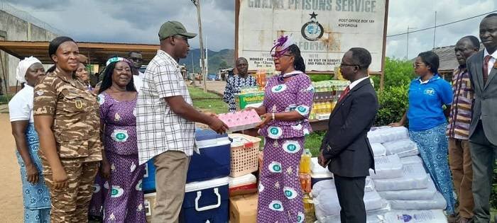 DSP Ballans (left) receiving the items from Ms Kwadade
